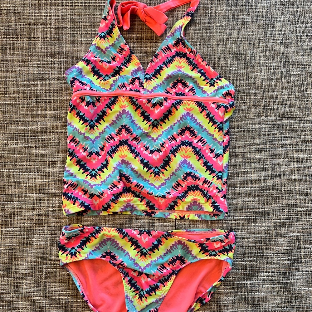 Girls justice brand, size 12 tankini swimsuit, gently used. So cute!
